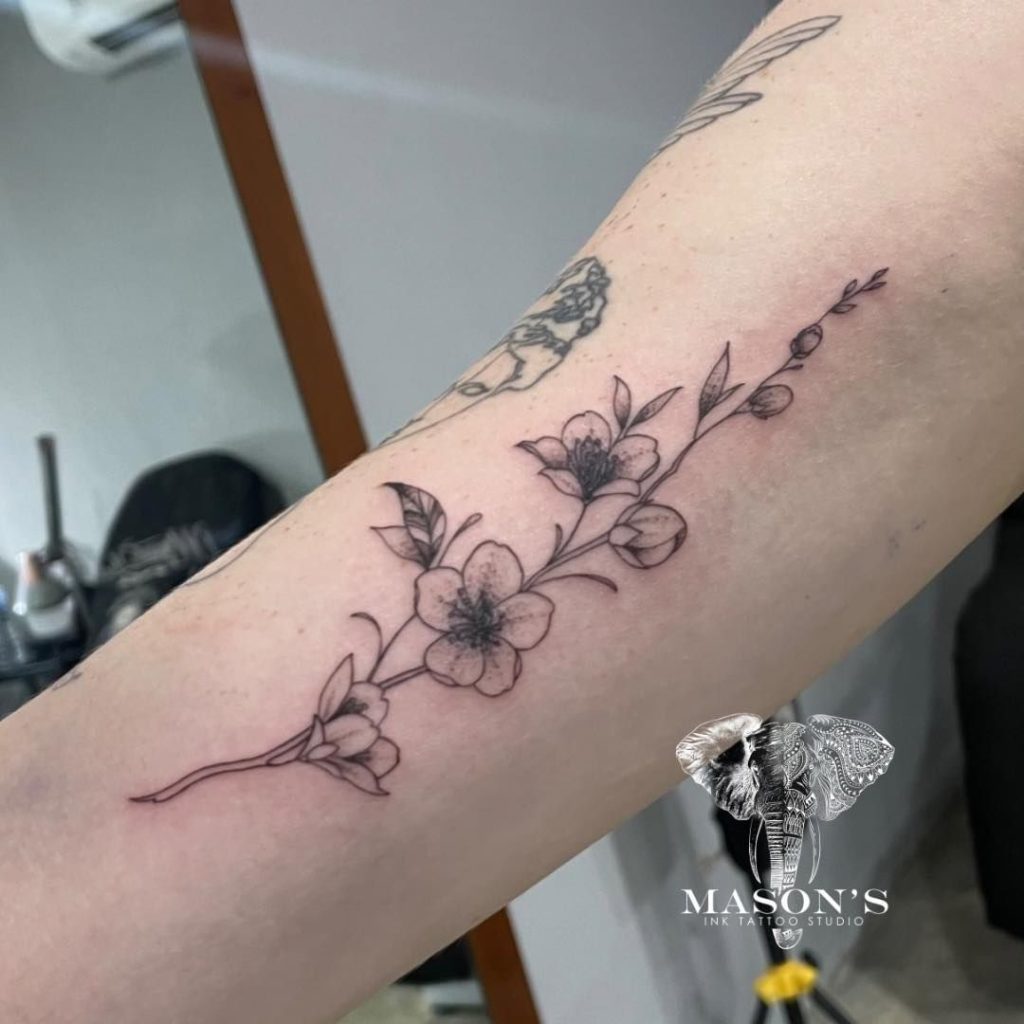 fine line floral tattoo